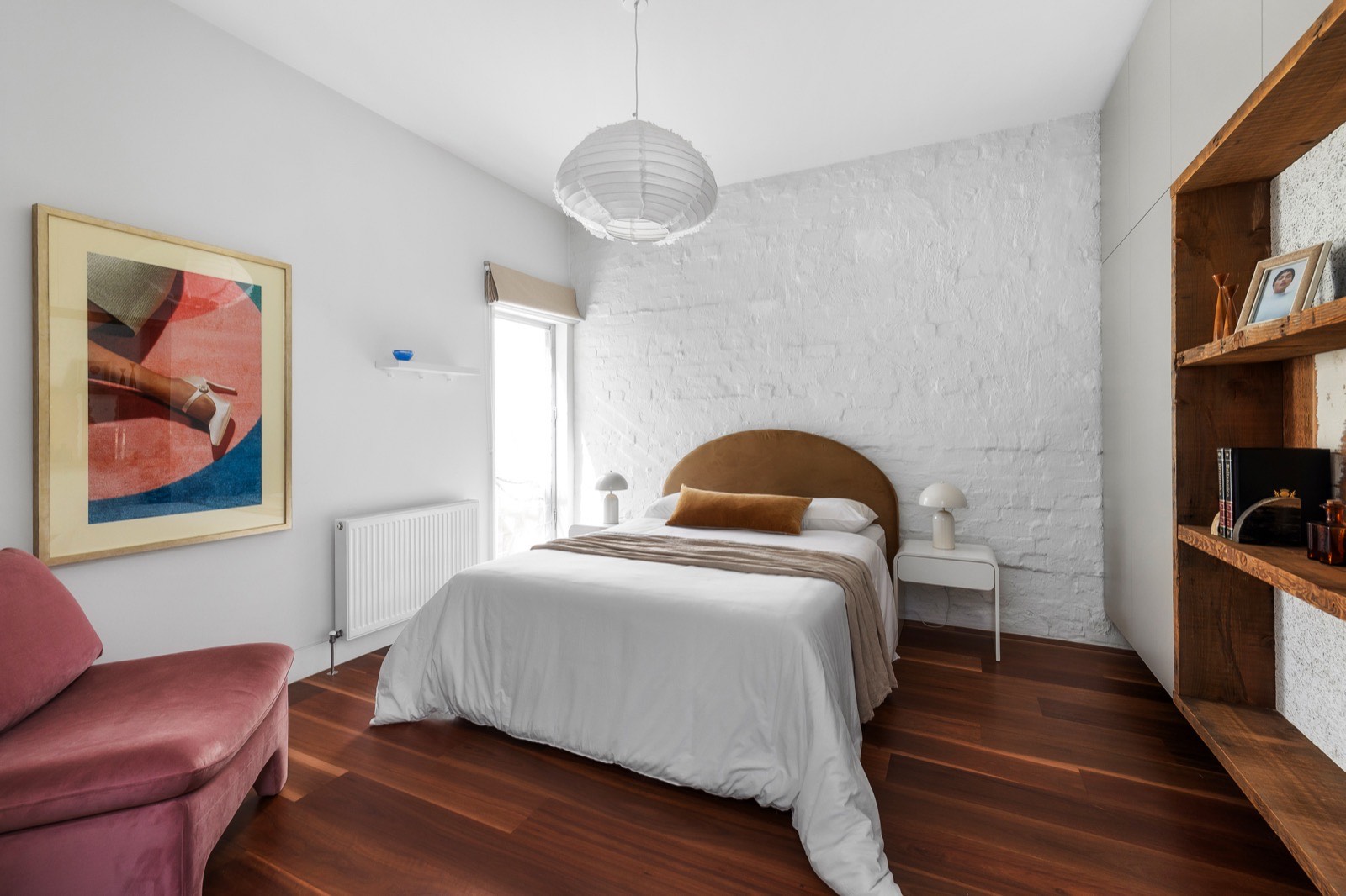 Bedroom with exposed brick