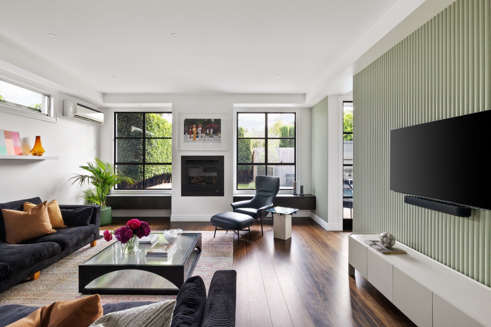 Living room with green feature wall